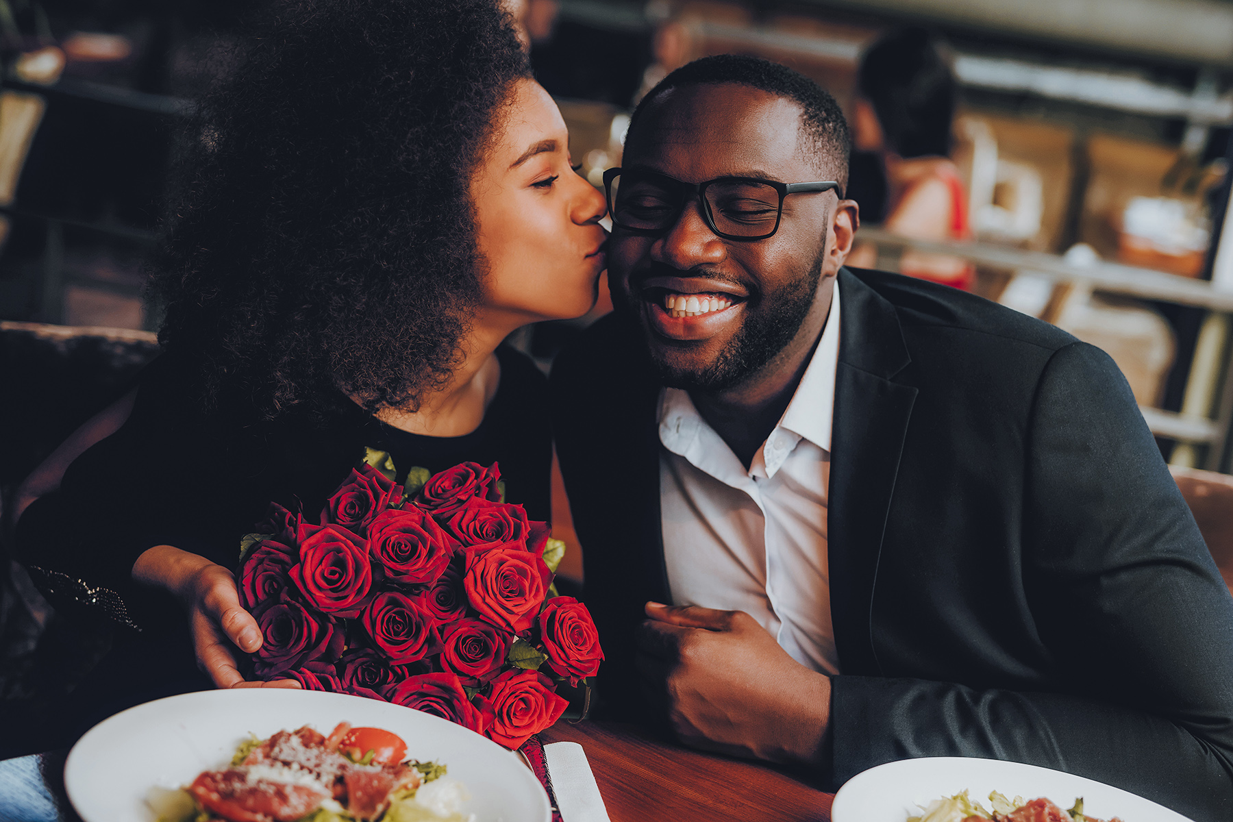 A man giving flowers to his date