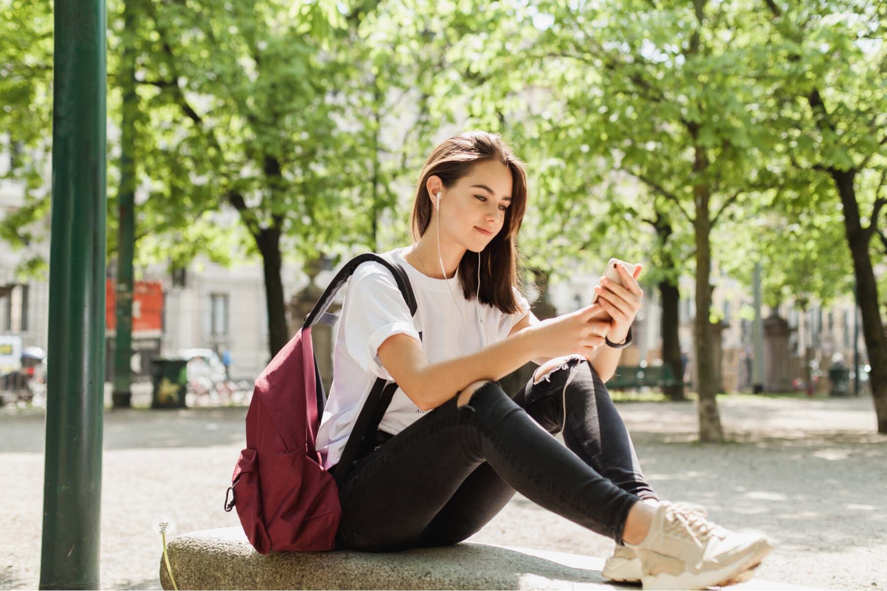 mobile operators in Luxembourg - girl sitting in park