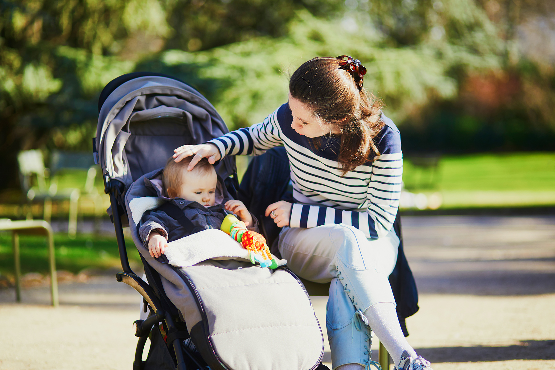 A mother with her toddler at a park